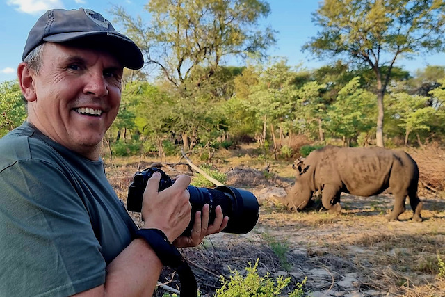 Chris and and a wonderful white rhino in Hwange, Zimbabwe